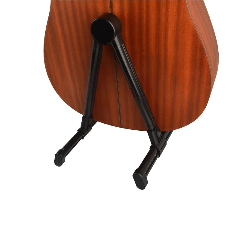 Wooden guitar on a black stand against a white background