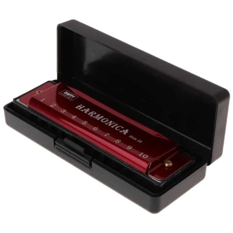 Red harmonica with black case on a white background