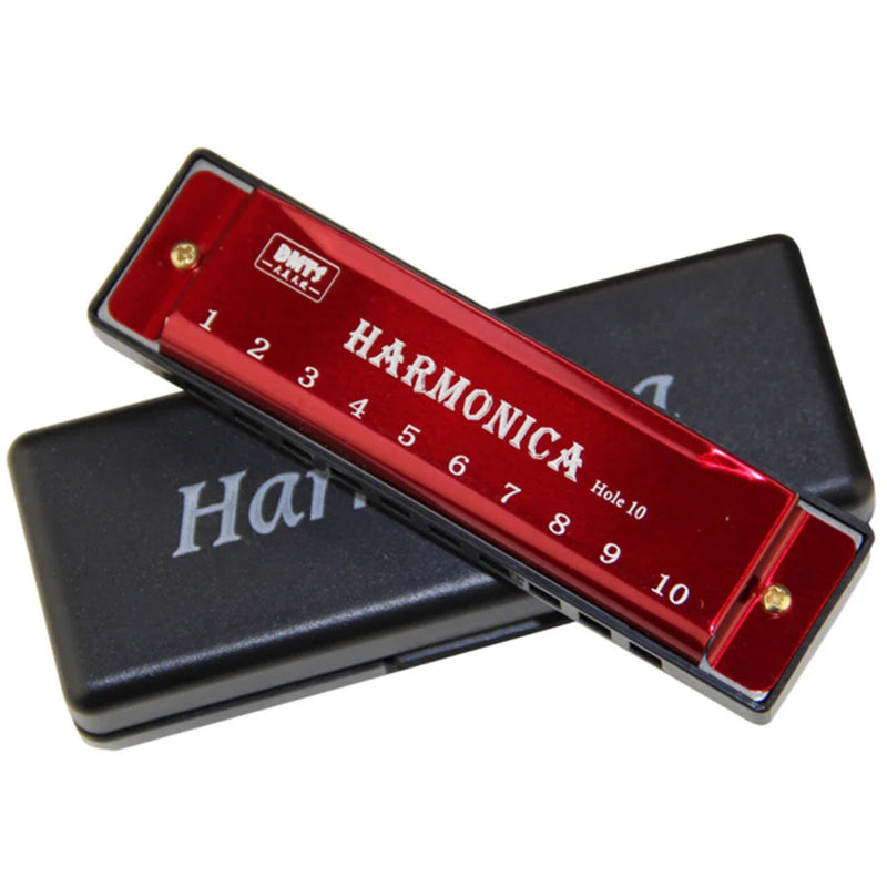 Red harmonica with black case on a white background