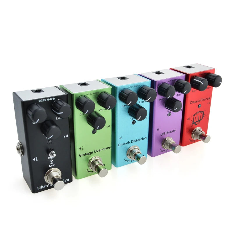 Five colorful guitar effect pedals on a white background
