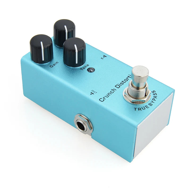Blue guitar effects pedal with knobs and switch on a white background
