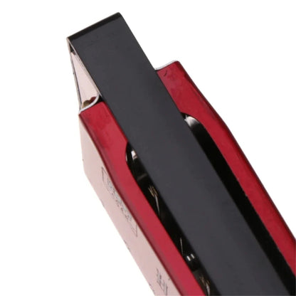 Red harmonica close-up on a white background