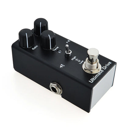 Guitar effects pedal with knobs and switch on a white background