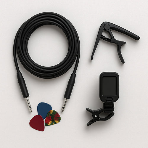 Guitar accessories including a cable, tuner, and picks on a white background