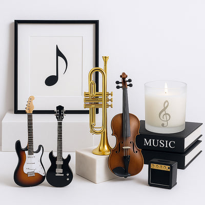 Music-themed decor items including guitars, a trumpet, a violin, a candle with a music symbol, and a framed note on a white background.